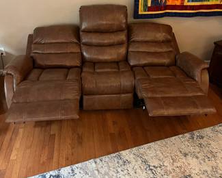 H103 - $650 Each. *2 Available* Ashley Brown Furniture Power Recline "Leather" Couches. Measures 84" W x 38" D x 41" T.  19.5 floor to seat height. Leather blend - it's 46% Leather, 37% PUC, 17% Polyester. Both are in very good condition. One has marks on the head rest (see photo)