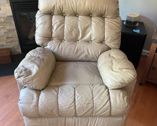 H4 - $60. Light Brown Leather Chair. Measures 35.5 Wide by 44 Deep by 42 Tall. Has wear on the handle, a hole under the right arm in the stitching and a tiny hole in the left arm - otherwise very comfy with lots of life left!