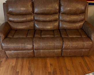 H103 - $650 Each. *2 Available* Ashley Brown Furniture Power Recline "Leather" Couches. Measures 84" W x 38" D x 41" T.  19.5 floor to seat height. Leather blend - it's 46% Leather, 37% PUC, 17% Polyester. Both are in very good condition. One has marks on the head rest (see photo)