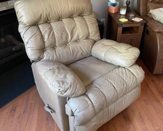H4 - $60. Light Brown Leather Chair. Measures 35.5 Wide by 44 Deep by 42 Tall. Has wear on the handle, a hole under the right arm in the stitching and a tiny hole in the left arm - otherwise very comfy with lots of life left!