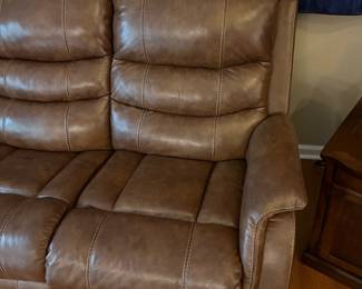 H103 - $650 Each. *2 Available* Ashley Brown Furniture Power Recline "Leather" Couches. Measures 84" W x 38" D x 41" T.  19.5 floor to seat height. Leather blend - it's 46% Leather, 37% PUC, 17% Polyester. Both are in very good condition. One has marks on the head rest (see photo)