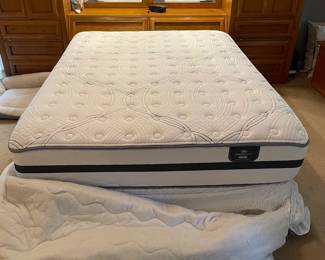 H7 - $350. Thomasville Wood Bed Frame with Mirrored Back. Measures 108.25 W by 18 D by 78 T. 