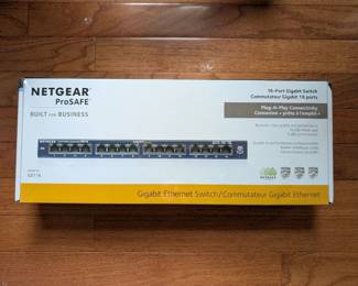 H59 - $40. Netgear ProSafe 16-Port Gigabit Switch.  New in box - sealed. 