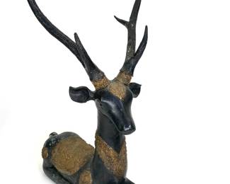 Lot 141	SARREID LTD (American, founded 1967), Recumbent Stag with Gilt RepoussE Ornament, patinated bronze and applied gilt brass repoussé panels, circa 1960s