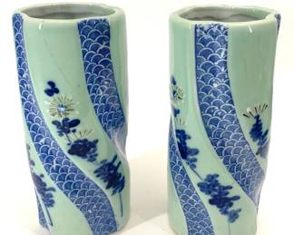 Lot 95	Pair Of Japanese Blue And White Porcelain Twisted Cylinder Vases, Seigaiha Wave And Floral Decoration, Meiji Period Circa 1868-1912