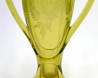 Lot 50	Fostoria Hand-Etched Two-Handled Green Trophy Vase in Uranium Glass (c. 1920s). Uranium Glass.