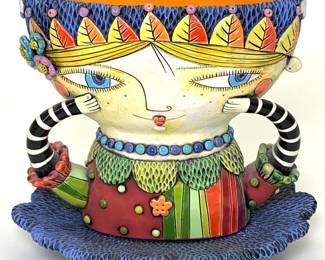 Lot 78	Natalya Sots (Kazakstan-American, b. 1972). Girl with Striped Arms Teacup and Saucer  (2013). Hand Built Stoneware, Glaze.