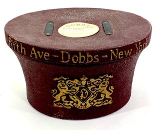 Lot 21	Dobbs Fifth Avenue Hard Case Hat Box and Stix Baer & Fuller Hat (c. 1910-1925). Cast Paper Box with Felt Hat.