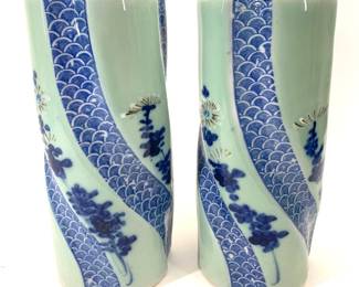 Lot 95	Pair Of Japanese Blue And White Porcelain Twisted Cylinder Vases, Seigaiha Wave And Floral Decoration, Meiji Period Circa 1868-1912