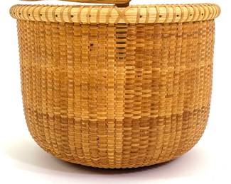 Lot 127	Ann L. Hicks (American, 20th century). Nantucket Basket with Open Swing Handle (20th century). Wood, Woven Rattan.