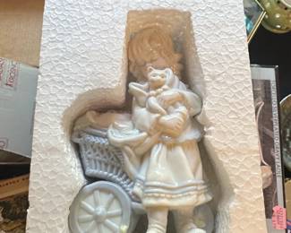 Porcelain Figurine of a Girl with a Cat and Basket
