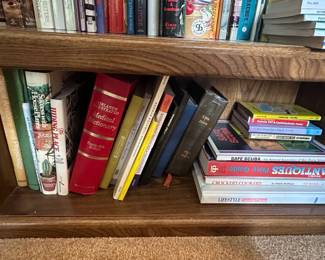 Oak Bookshelf with Assorted Books and Artwork second image