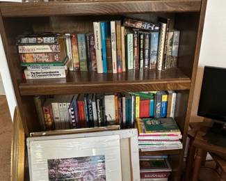 Oak Bookshelf with Assorted Books and Artwork