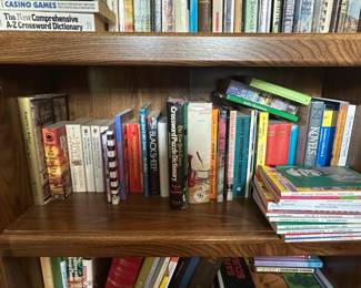 Oak Bookshelf with Assorted Books and Artwork third image