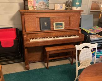 GREAT OLD OAK PIANO. IT IS ON GROUND LEVEL