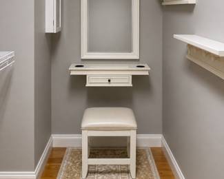 Another floating vanity station. Includes wall mirror, floating shelf with storage and cushioned stool
