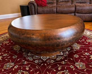 Round copper look coffee table with wood base