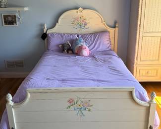 Full size bed with headboard & footboard and floral embellishments