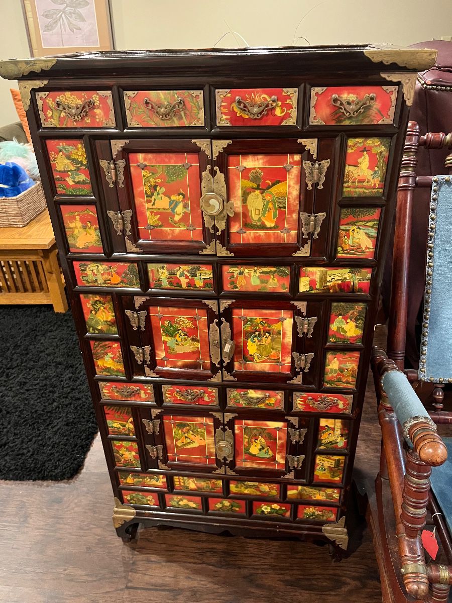 Vintage Korean medicine chest with figural and floral painted panels. With eight drawers and three pairs of cabinet drawers.