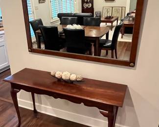 Vintage ornate mirror; sofa table.