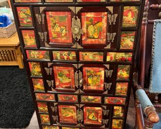 Vintage Korean medicine chest with figural and floral painted panels. With eight drawers and three pairs of cabinet drawers.