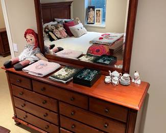 Nine-drawer dresser with mirror.