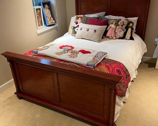 Queen bed with mattress and box spring.
