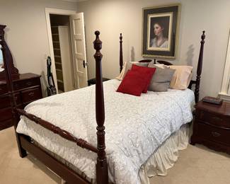 Queen poster bed with mattress and box spring.