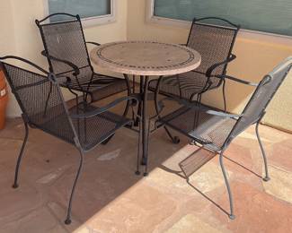 Round stone patio table-30x29 & 4 metal chairs-23x33