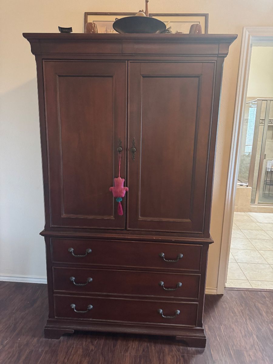 Beautiful armoire set with matching dresser.