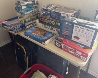 Model plains, ships, and luggage