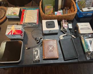 Apple TV, computer, Kindle, camera lens 