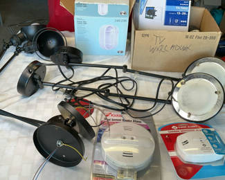Lot 69: Assorted Lighting Fixtures, TV Wall Mount, and Safety Alarms