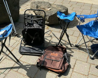Lot 49: Blue folding camping chairs, trekking poles, and brown backpack