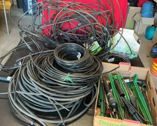 Lot 81: Assorted garden irrigation hoses, fittings, and timer