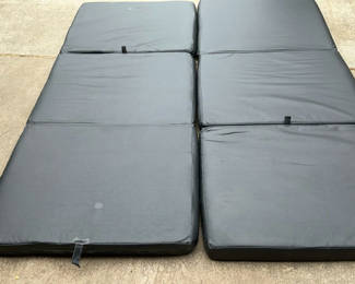 Lot 41: Four black folding gym mats