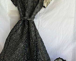 Lot 50: Black floral-print dress with belt and striped romper