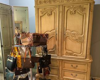 Large selection of designer bags and matching armoire