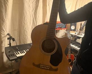 Fender FA Series Acoustic Guitar Fender FA Series acoustic guitar in natural finish. Full-size dreadnought body, spruce top, solid playable condition. 