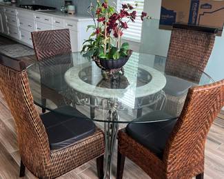 round iron base table with 4 wicker chairs