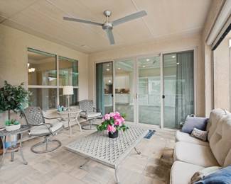 2 rocking outdoor chairs, small tables and lamp