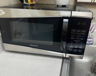 #57	West Bend Counter top Micowave -Working 	 $25.00 