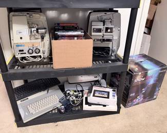 electric typewriter, digital frames, laminators, keyboards, vintage sears projectors, dvds, vhs