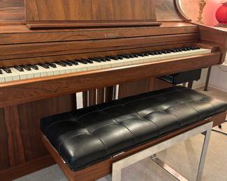 Kimball electric player piano with mid-century style and chrome details. Electric cassette player visible shown here.