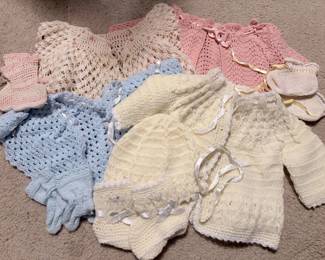 Vintage crocheted baby sweaters and booties