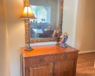 Beautiful Gold Scrolled Mirror with a solid wood table. 