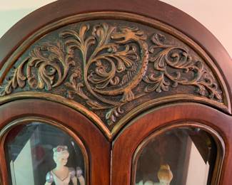 Detail of curio cabinet with dragon detail