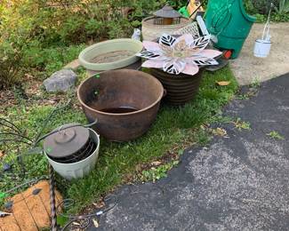 large iron cauldron; garden