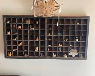 miniatures in a printer's tray