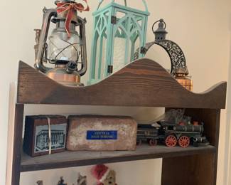 Lamps; iron train; bricks from Central High School and National Life Insurance 
